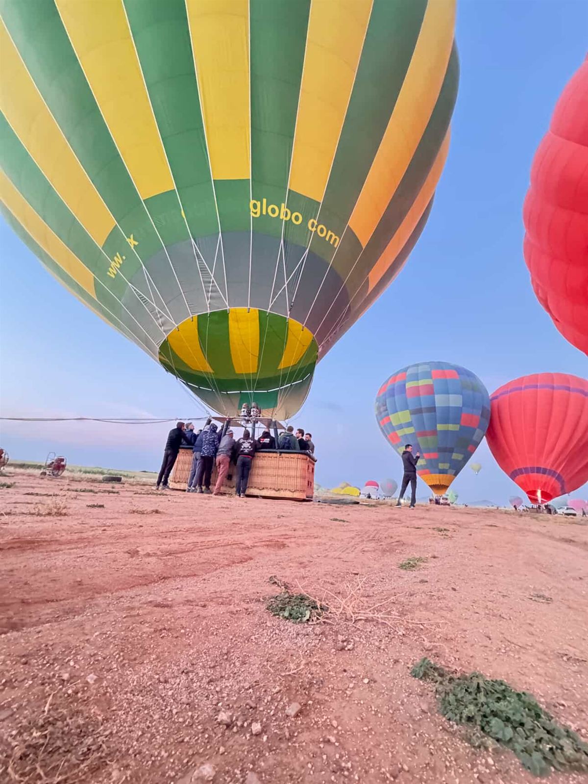 Our crew holding the basket while the balloon fills with hot air